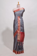 Steal blue dola silk saree with contrast coper gold zari border and contrast blouse