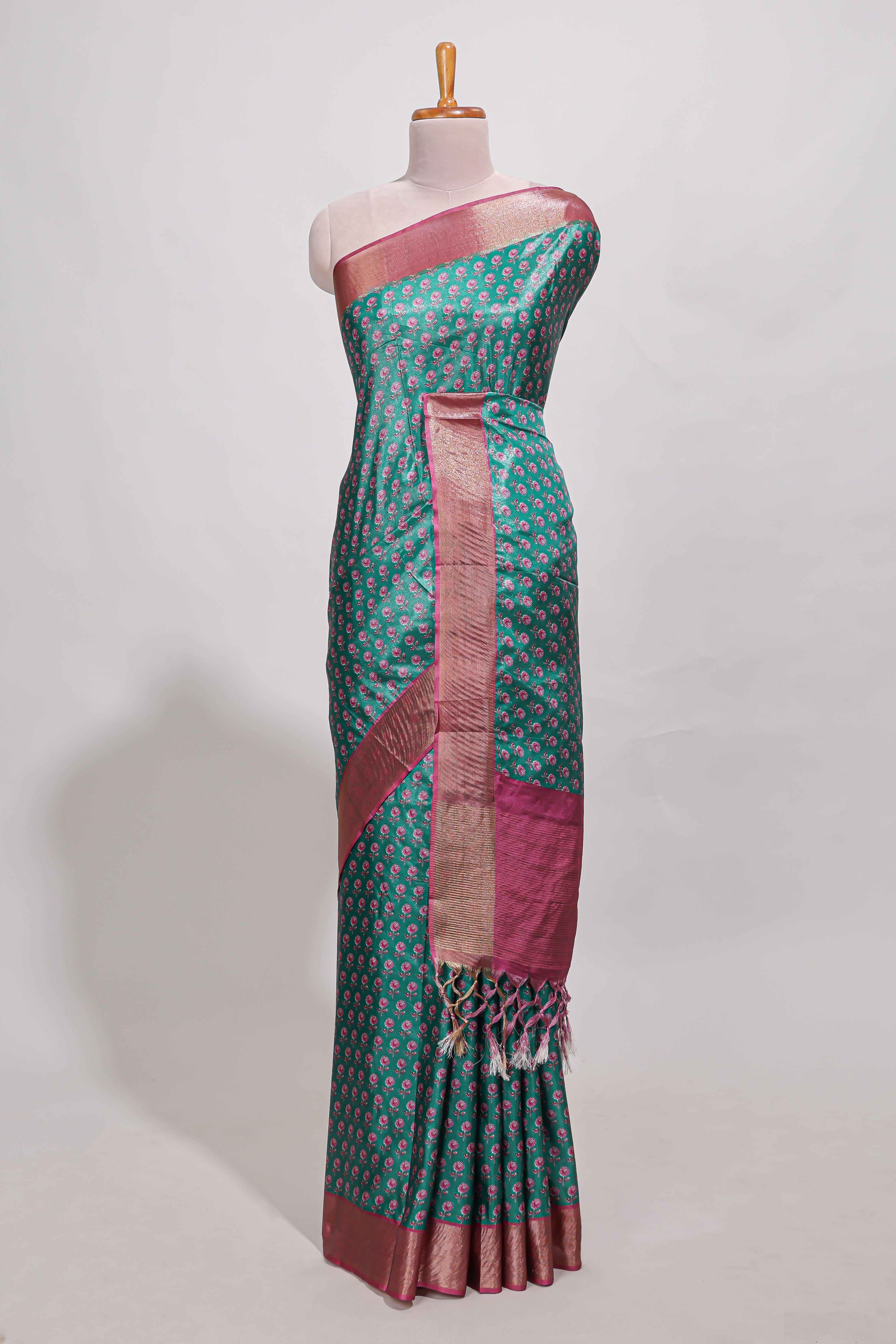 Bottle green dola silk saree with contrast coper gold zari border and contrast blouse