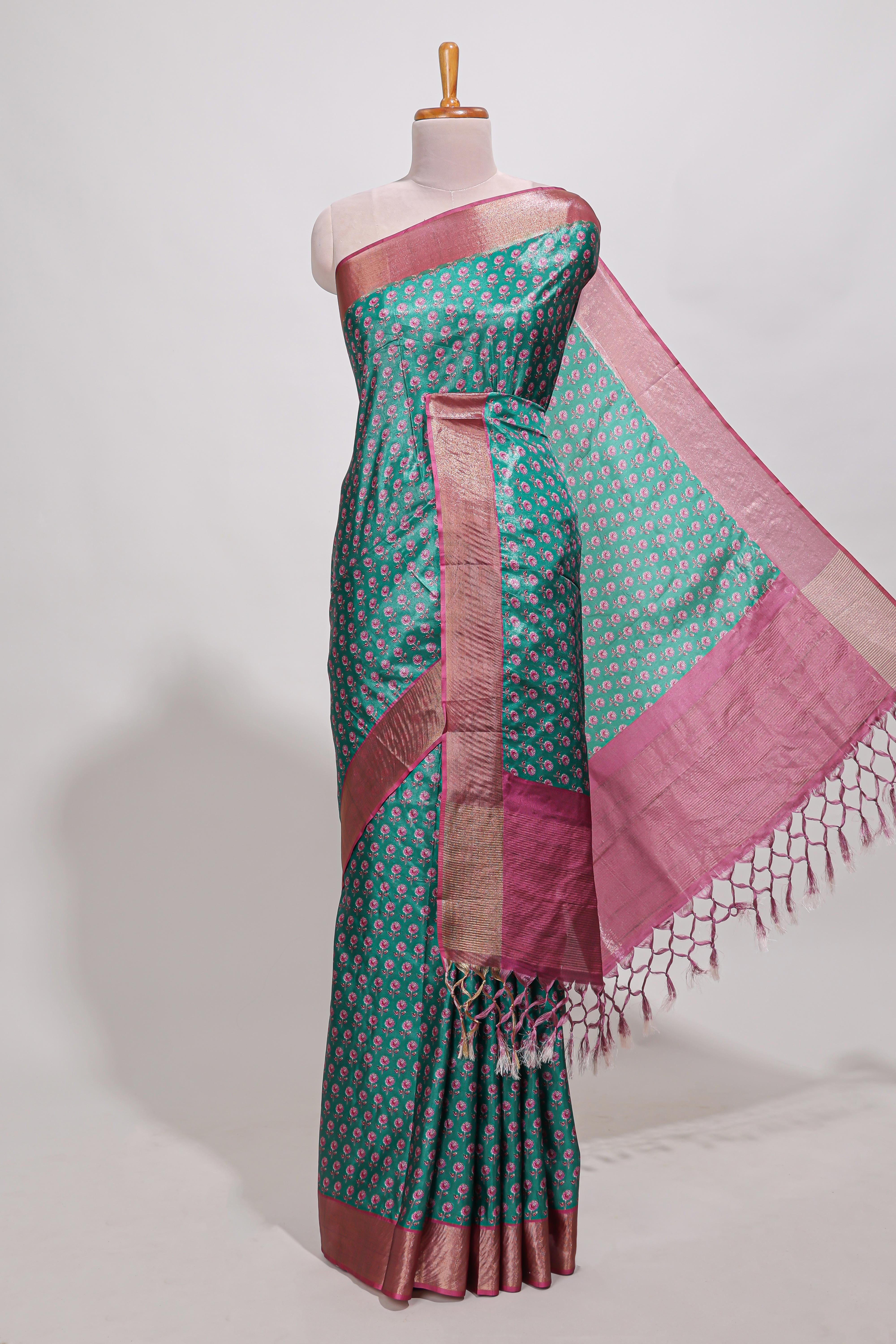 Bottle green dola silk saree with contrast coper gold zari border and contrast blouse