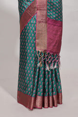 Bottle green dola silk saree with contrast coper gold zari border and contrast blouse