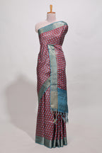 Maroon dola silk saree with contrast coper gold zari border and contrast blouse