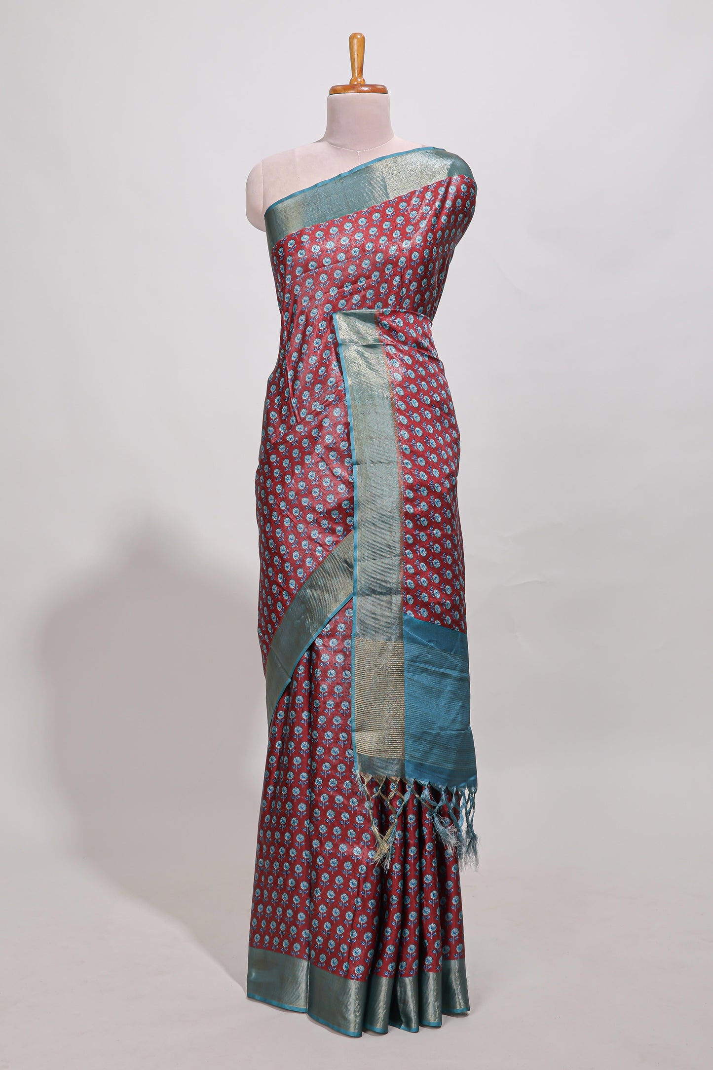 Maroon dola silk saree with contrast coper gold zari border and contrast blouse