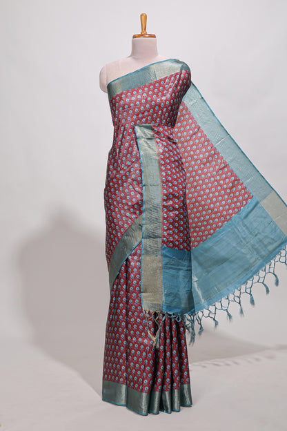 Maroon dola silk saree with contrast coper gold zari border and contrast blouse