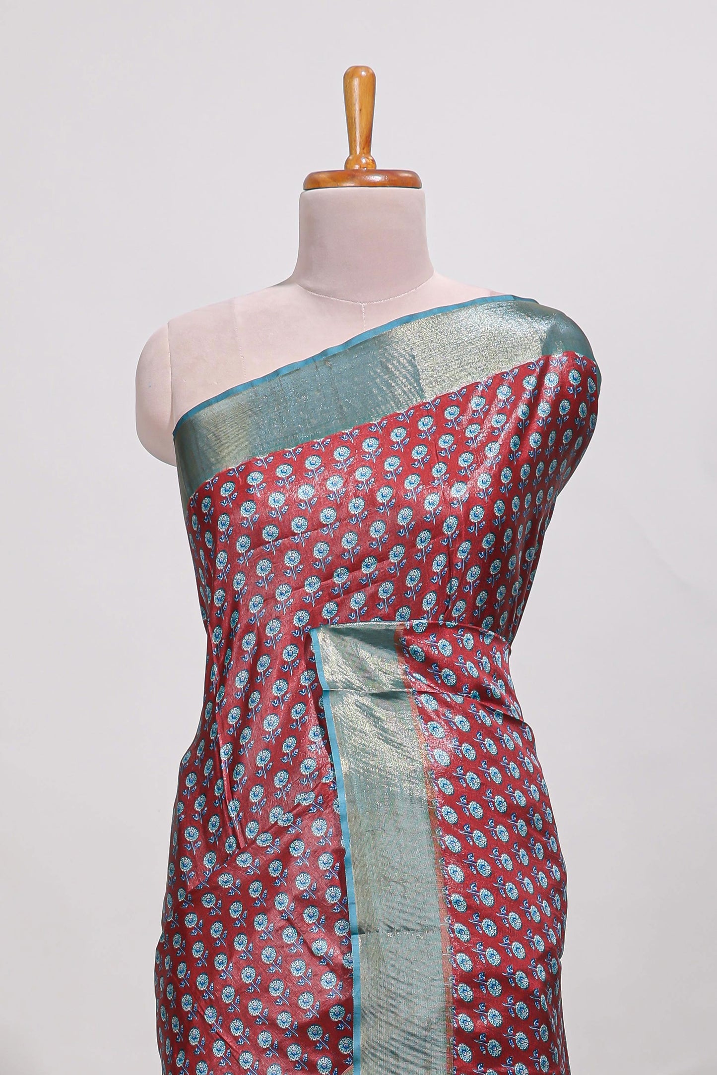 Maroon dola silk saree with contrast coper gold zari border and contrast blouse