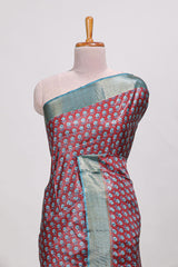 Maroon dola silk saree with contrast coper gold zari border and contrast blouse
