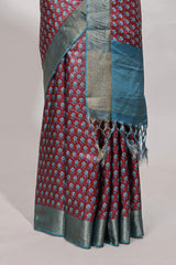 Maroon dola silk saree with contrast coper gold zari border and contrast blouse