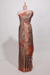 Brown dola silk saree with contrast coper gold zari border and contrast blouse