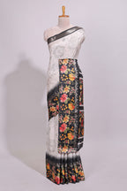 Off white floral design dola silk saree with contrast black border and printed motifs blouse