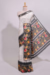 Off white floral design dola silk saree with contrast black border and printed motifs blouse