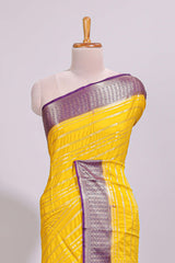 Yellow zari striped dola silk saree with contrast zari border and striped pallu