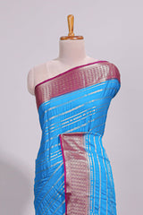 Blue zari striped dola silk saree with contrast zari border and striped pallu