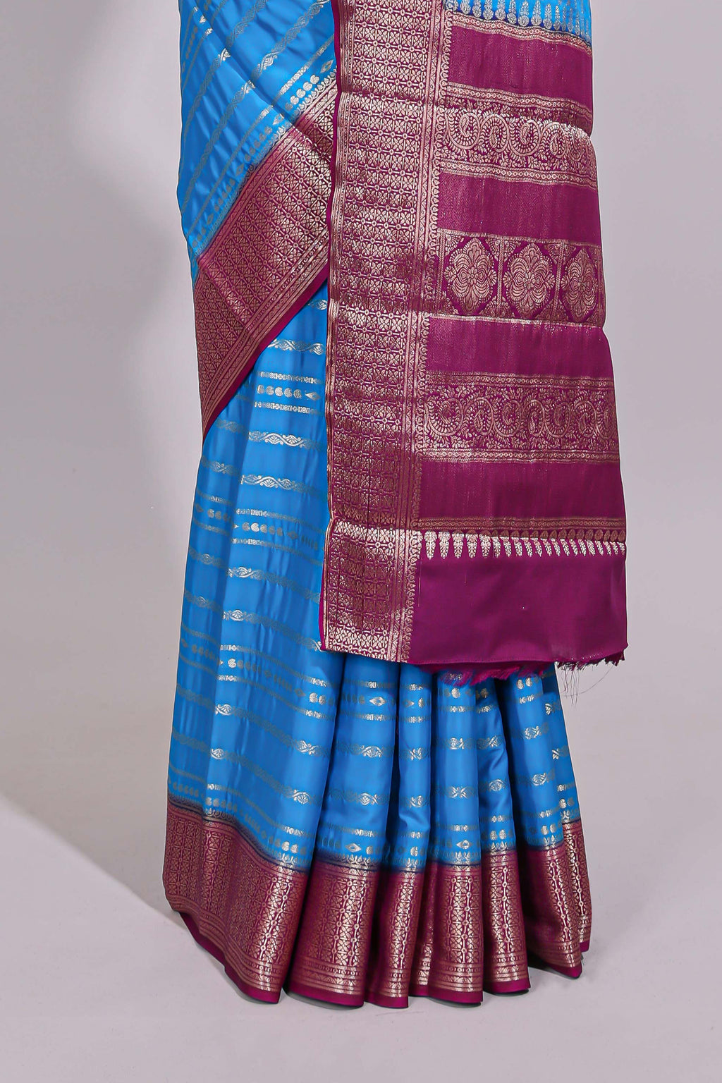 Blue zari striped dola silk saree with contrast zari border and striped pallu