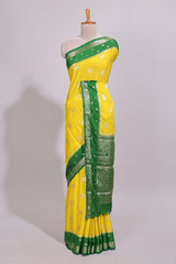 Yellow striped bird zari butta dola silk saree with contrast zari border and blouse