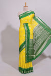 Yellow striped bird zari butta dola silk saree with contrast zari border and blouse