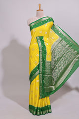 Yellow striped bird zari butta dola silk saree with contrast zari border and blouse