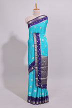 Blue striped bird zari butta dola silk saree with contrast zari border and blouse