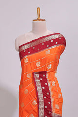 Orange striped bird zari butta dola silk saree with contrast zari border and blouse