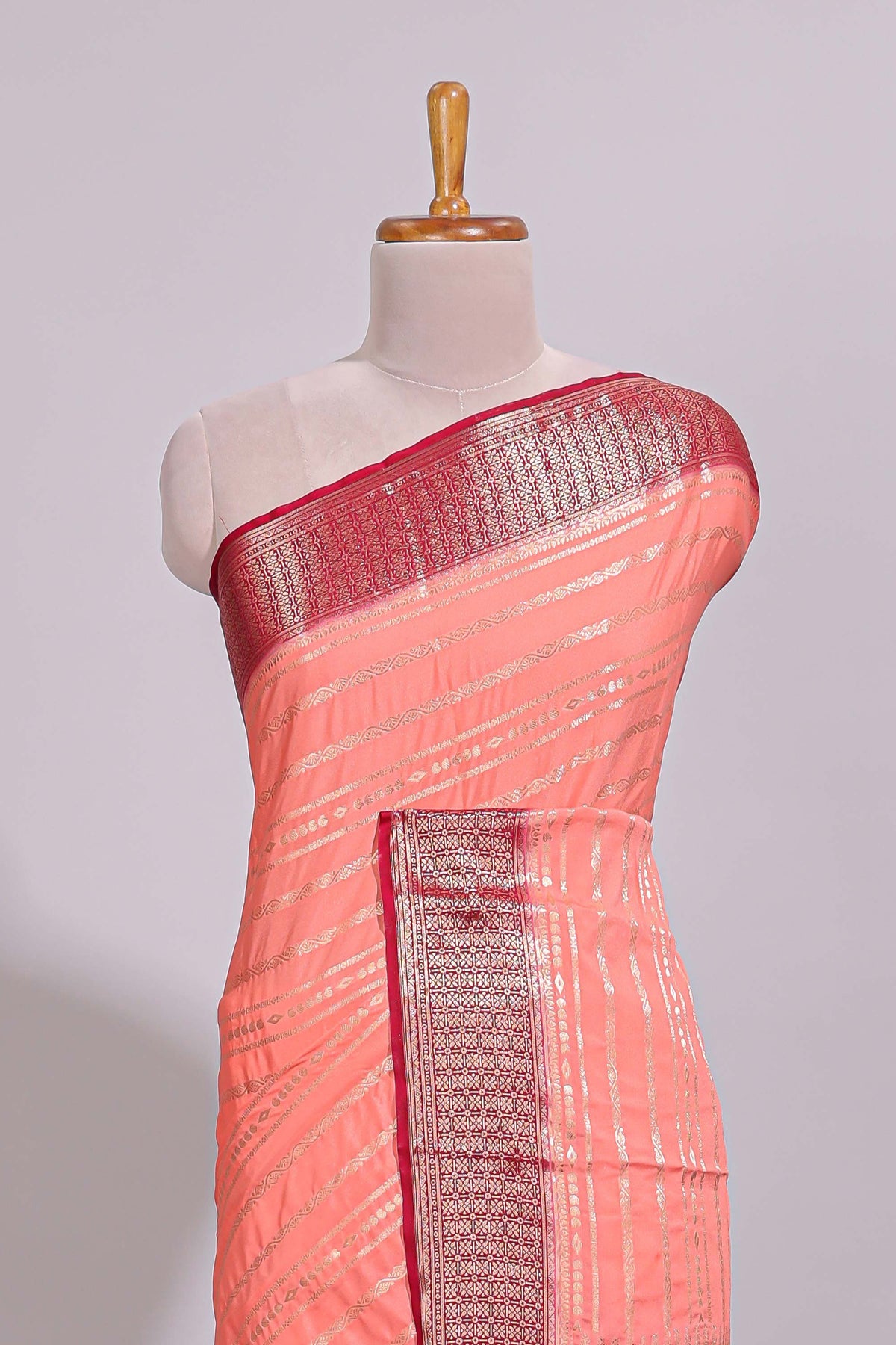 Peach zari striped dola silk saree with contrast zari border and striped pallu