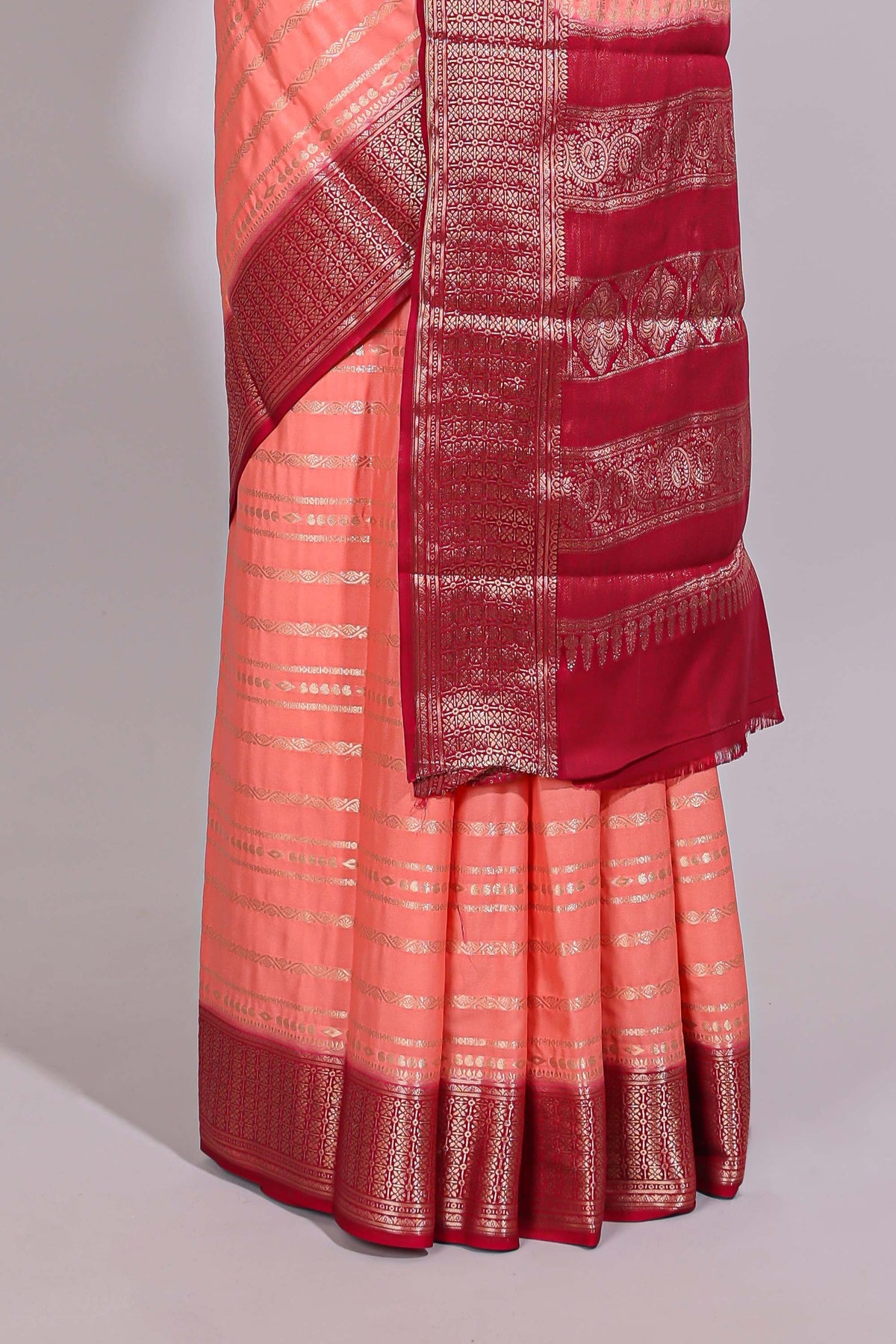 Peach zari striped dola silk saree with contrast zari border and striped pallu