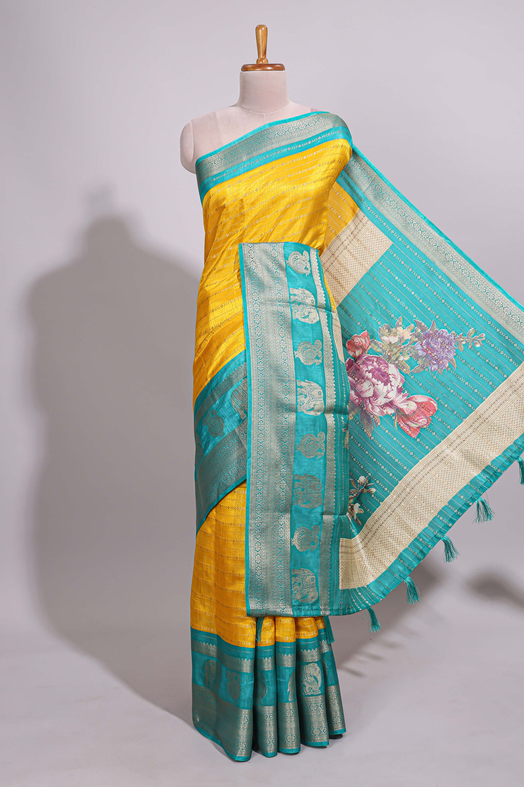 Yellow zari striped dola silk saree with contrast zari border and floral printed pallu