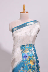 Off white floral design dola silk saree with contrast turquoise green floral border and printed motifs blouse