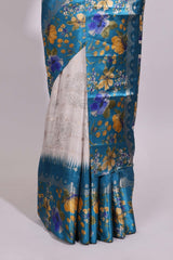 Off white floral design dola silk saree with contrast turquoise green floral border and printed motifs blouse