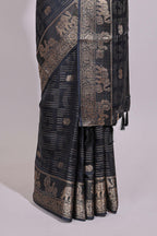 Black striped elephant & bird zari butta dola silk saree with self zari border and matching zari motifs blouse