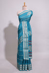 Teal blue Dola silk saree all over zari lines and motifs design with silver zariborder and self printed pallu and matching blouse