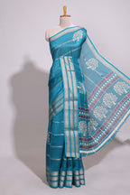 Teal blue Dola silk saree all over zari lines and motifs design with silver zari  border and self printed pallu and matching blouse