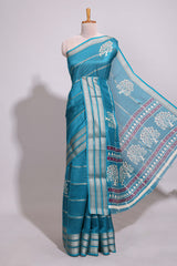 Teal blue Dola silk saree all over zari lines and motifs design with silver zariborder and self printed pallu and matching blouse