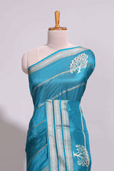 Teal blue Dola silk saree all over zari lines and motifs design with silver zariborder and self printed pallu and matching blouse
