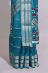 Teal blue Dola silk saree all over zari lines and motifs design with silver zariborder and self printed pallu and matching blouse