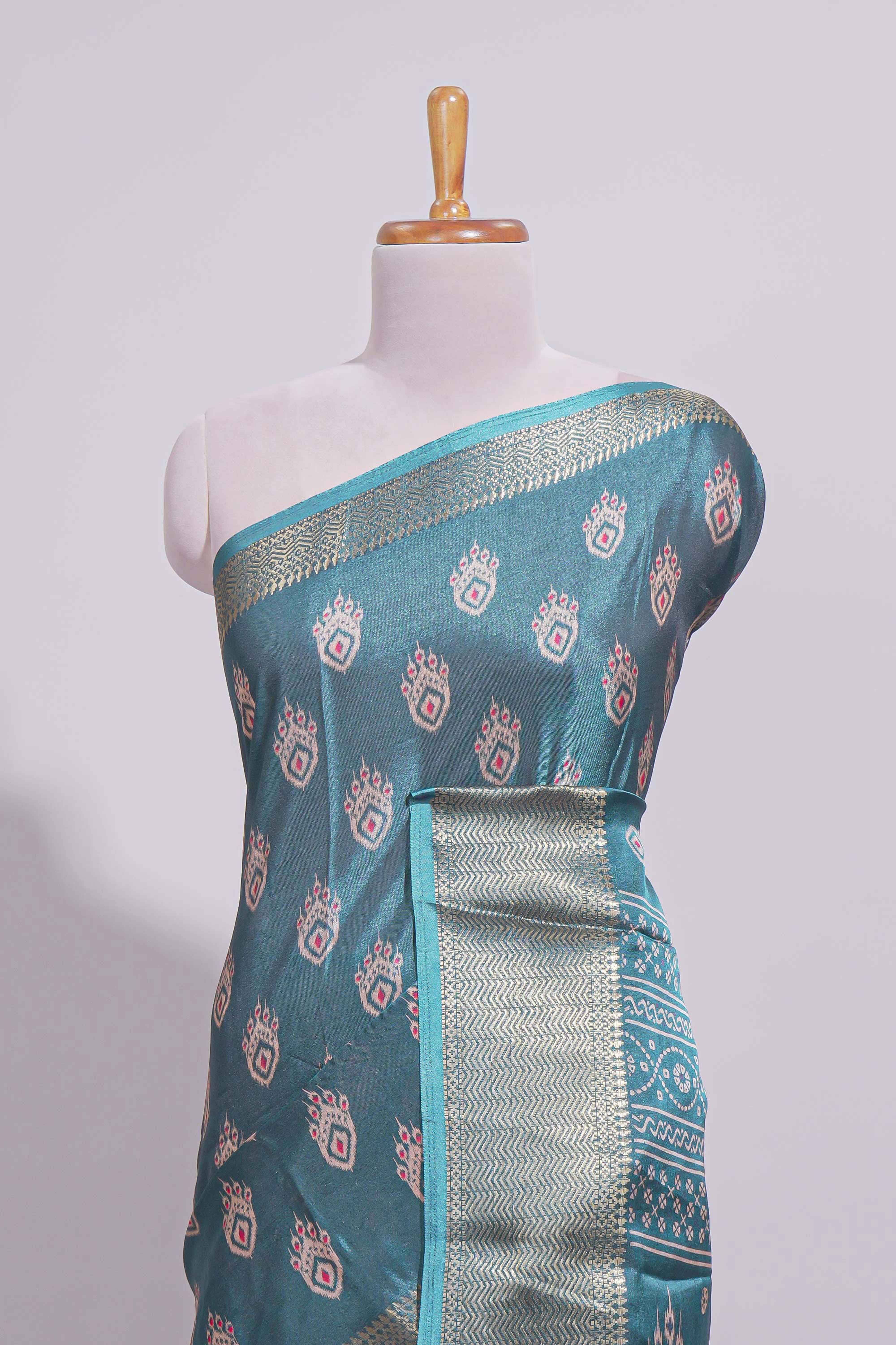 Peacock green zari butta dola silk saree with self zari border and matching zari motifs blouse
