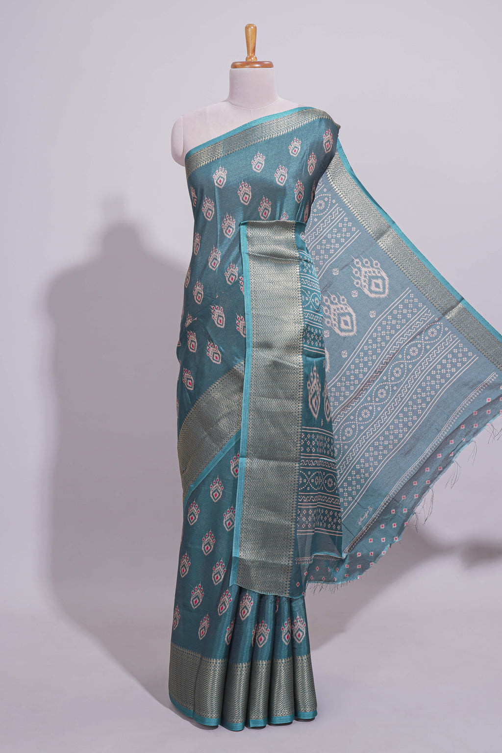 Peacock green zari butta dola silk saree with self zari border and matching zari motifs blouse