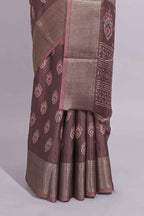 Brown dola silk saree with all over butta self zari border and matching zari motifs blouse