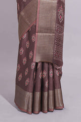 Brown dola silk saree with all over butta self zari border and matching zari motifs blouse
