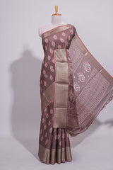 Brown dola silk saree with all over butta self zari border and matching zari motifs blouse