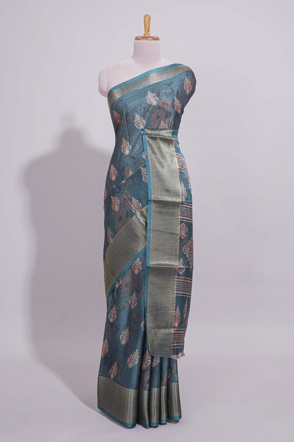Pine green dola silk saree with all over butta self zari border and matching motifs blouse