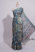 Pine green dola silk saree with all over butta self zari border and matching motifs blouse