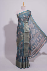 Pine green dola silk saree with all over butta self zari border and matching motifs blouse