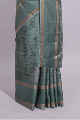 Teal green Dola Silk Saree all over floral motifs fine zari stripes and zari border with matching printed blouse