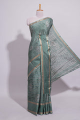 Teal green Dola Silk Saree all over floral motifs fine zari stripes and zari border with matching printed blouse