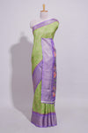Green striped zari design dola silk saree with contrast zari border and floral design blouse