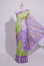 Green striped zari design dola silk saree with contrast zari border and floral design blouse