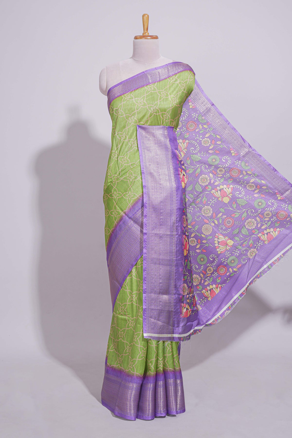 Green striped zari design dola silk saree with contrast zari border and floral design blouse