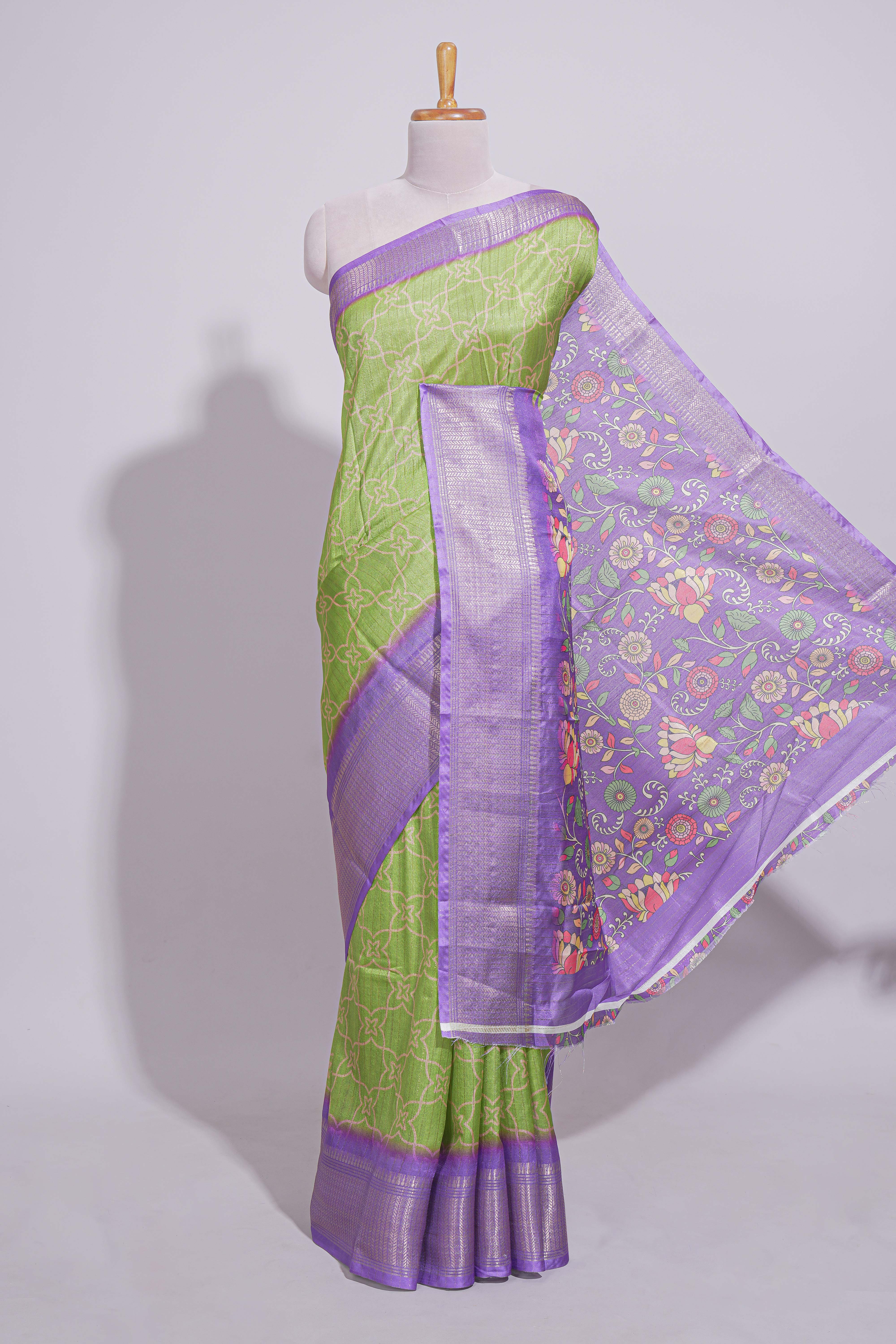 Green striped zari design dola silk saree with contrast zari border and floral design blouse