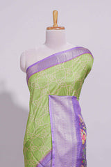 Green striped zari design dola silk saree with contrast zari border and floral design blouse