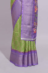 Green striped zari design dola silk saree with contrast zari border and floral design blouse