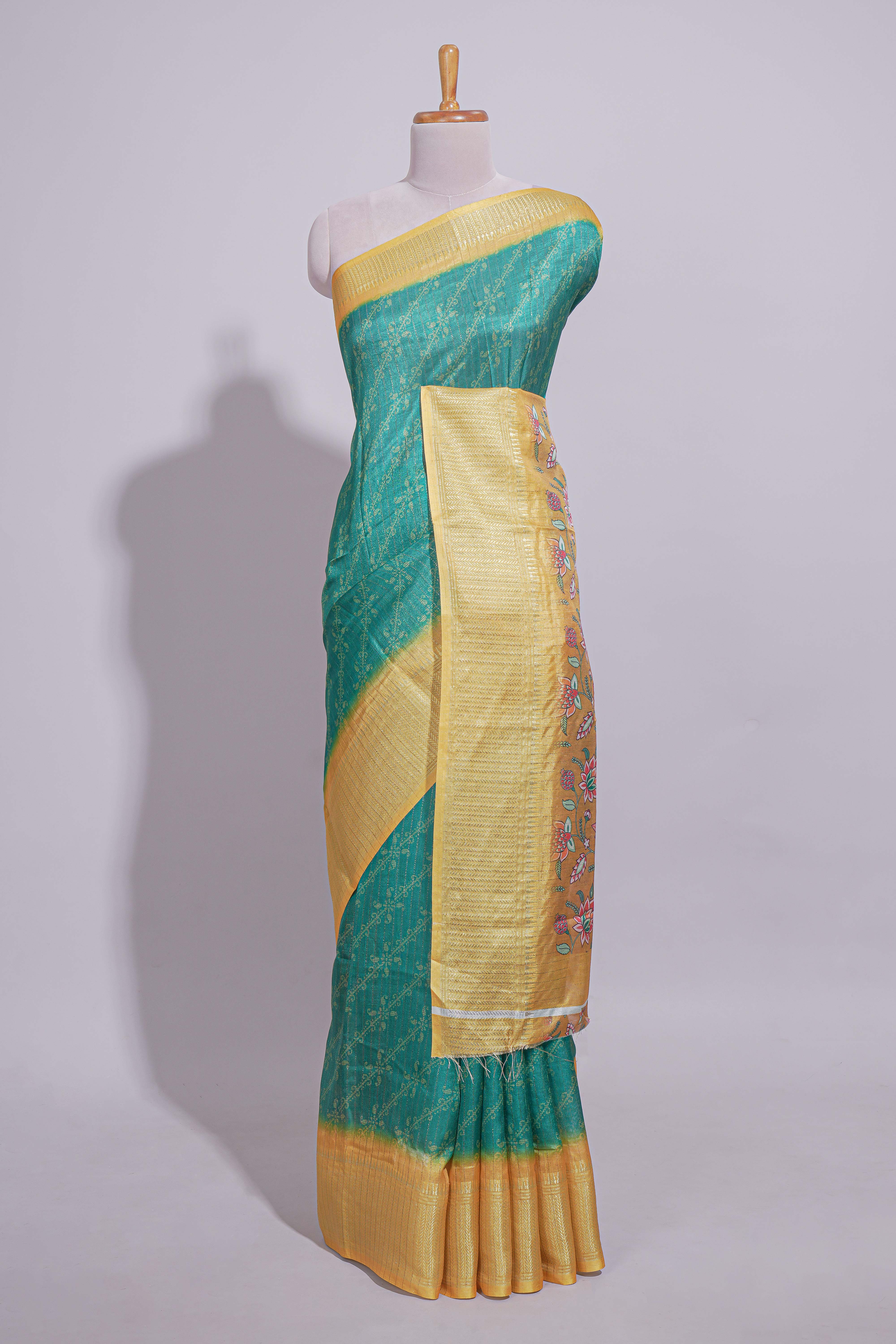 Teal green striped zari design dola silk saree with contrast zari border and floral design blouse
