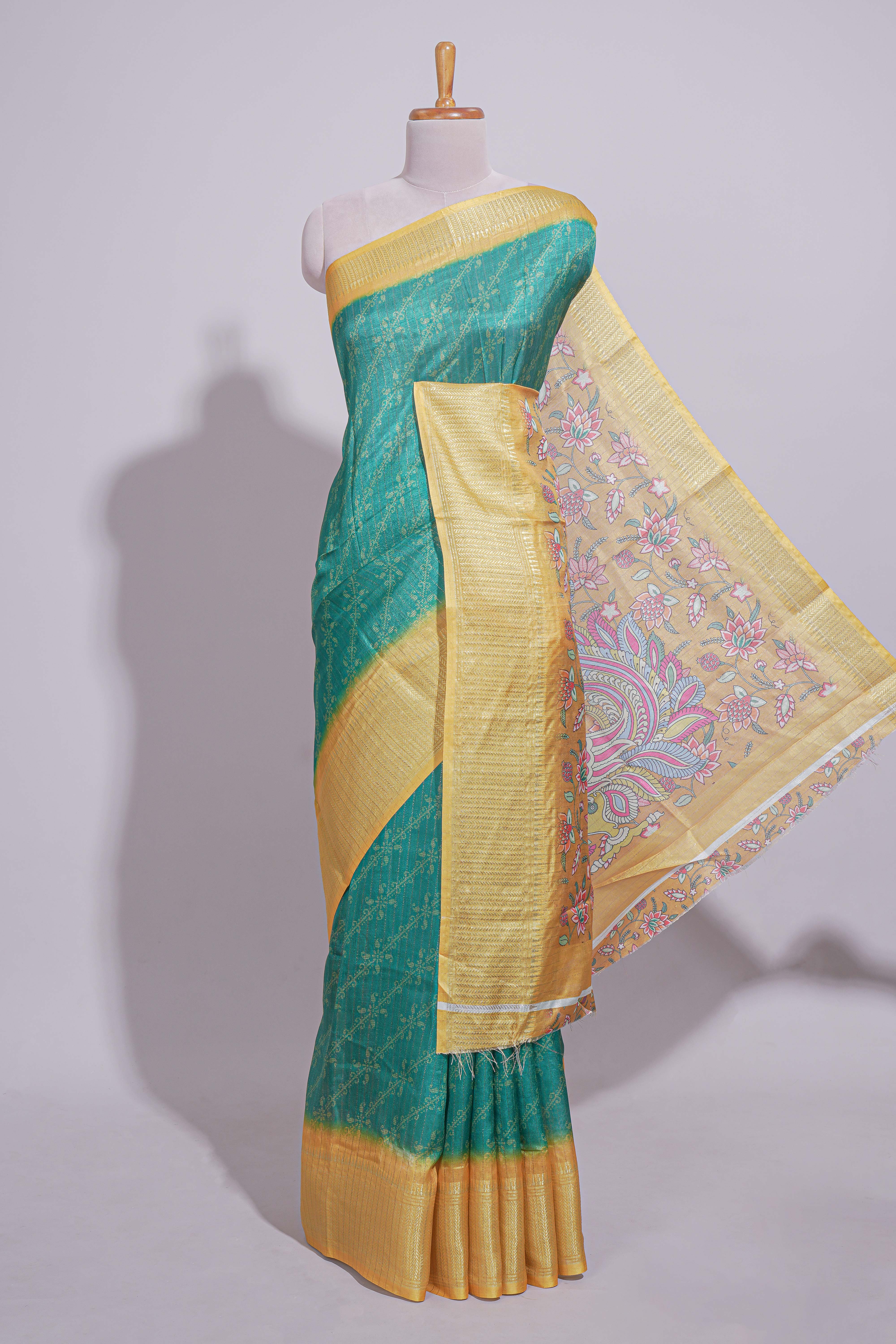 Teal green striped zari design dola silk saree with contrast zari border and floral design blouse